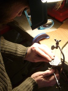 Hand piercing a stainless steel concertina-style bell push